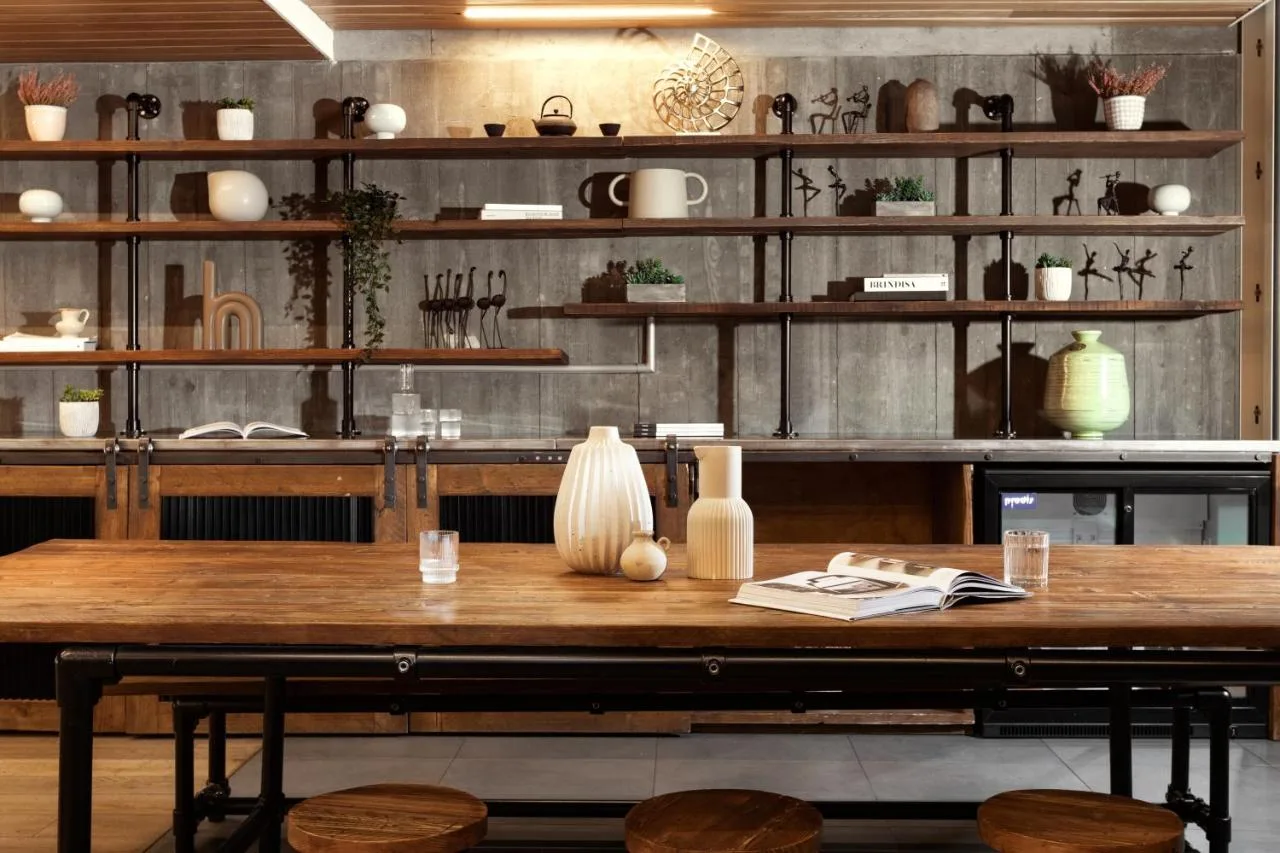 a wooden table in a room with wooden shelves at Native Bankside in London