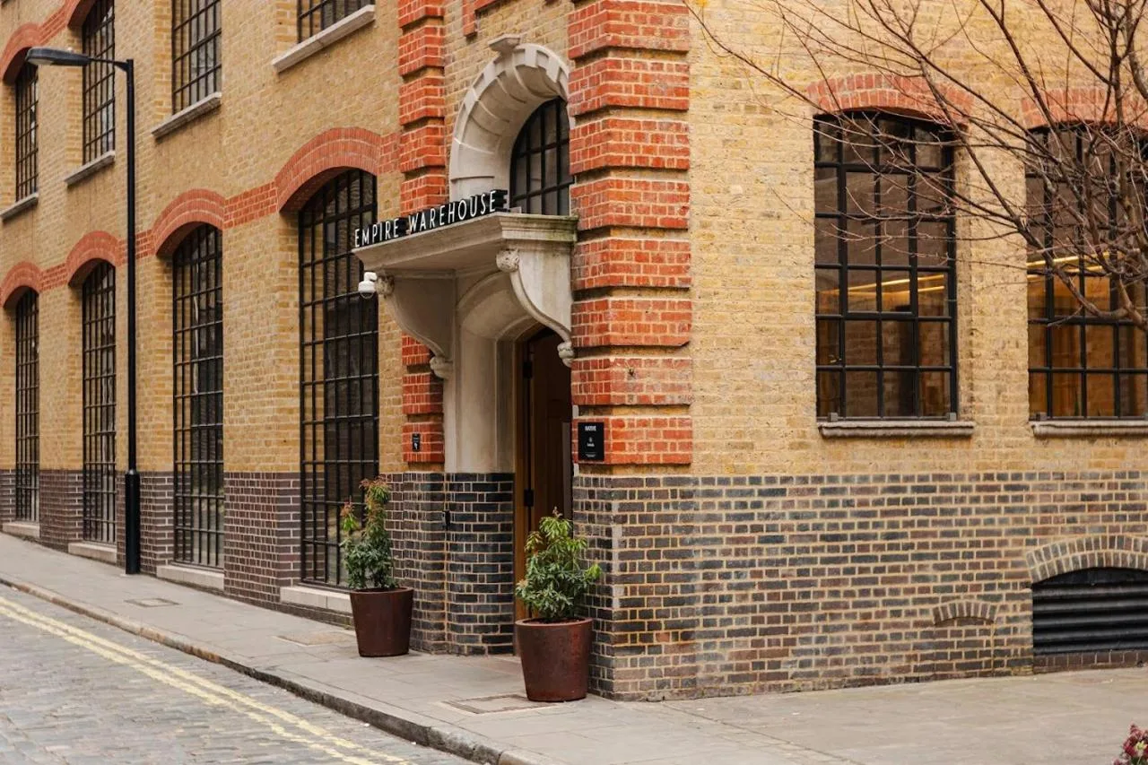a brick building with two potted plants in front of it at Native Bankside in London